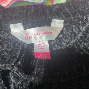 Large super soft black sweater with cleavage and wrist accessories